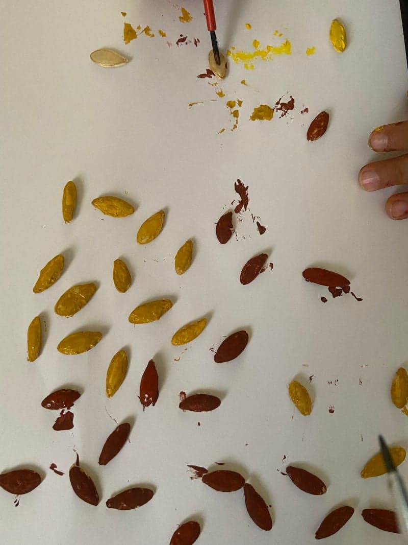 Tree with pumpkin seeds leaves craft for preschoolers with free printable tree.