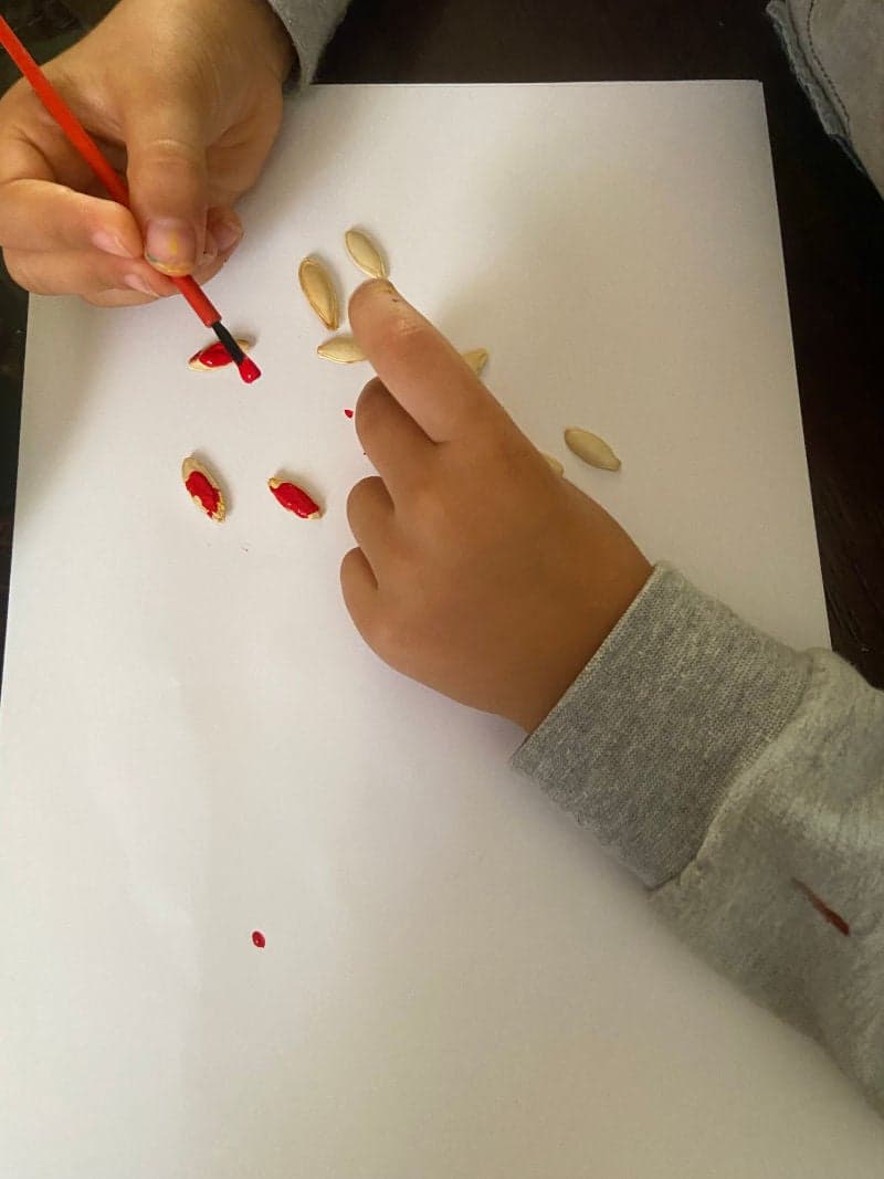 Tree with pumpkin seeds leaves craft for preschoolers with free printable tree.