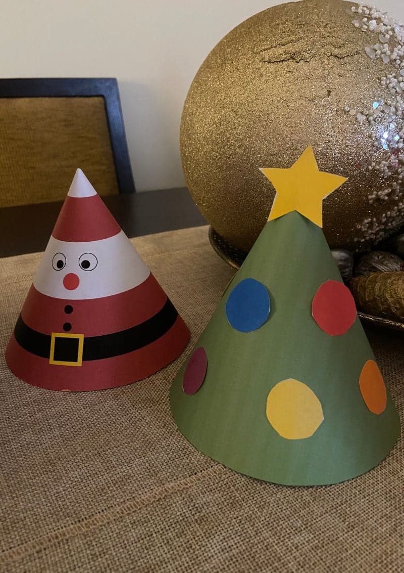 Free printable craft for kids for the holidays. Christmas and New Year's. Cone Christmas tree and Santa Claus.